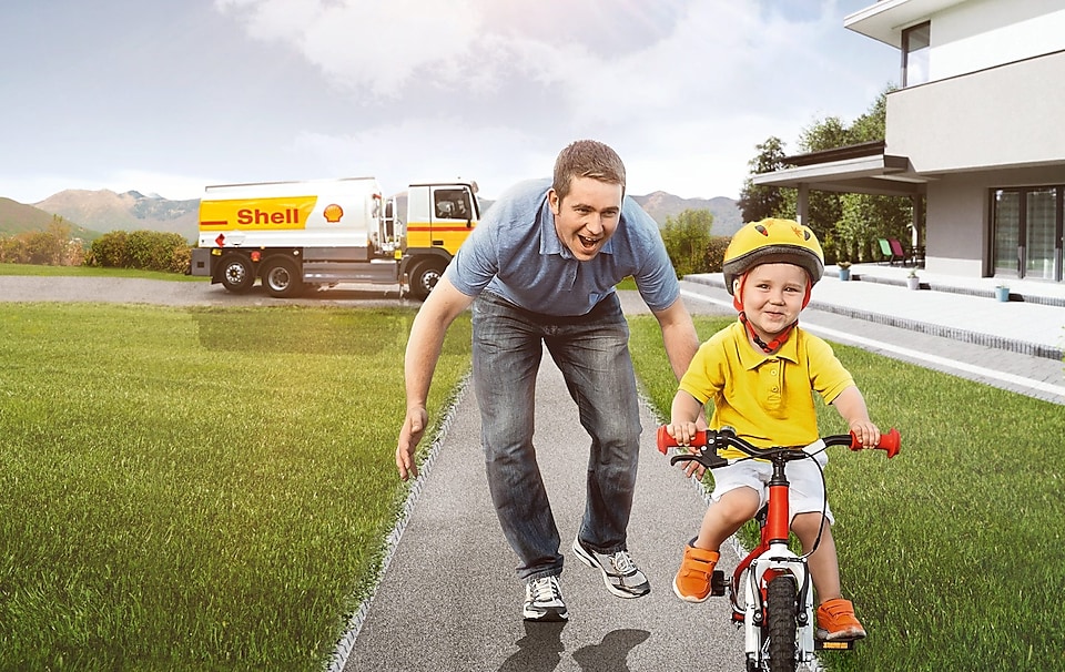 son-riding-bicycle-father-running-behind-him